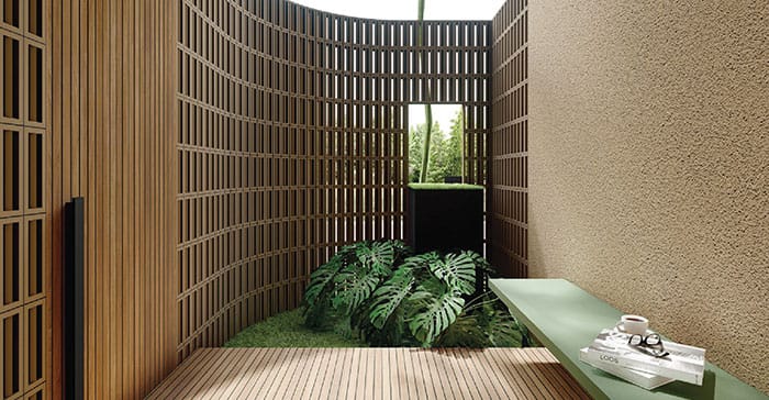 Desain inner garden di The Hana Park dengan elemen kayu vertikal, pencahayaan alami, dan tanaman tropis, menciptakan suasana reflektif yang menyatu dengan alam — tempat pulang yang tenang dan menenangkan.